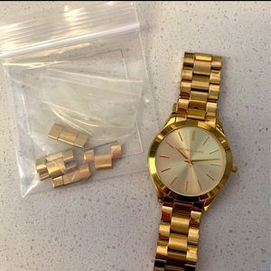 Gold stainless steal slim Women’s MK watch